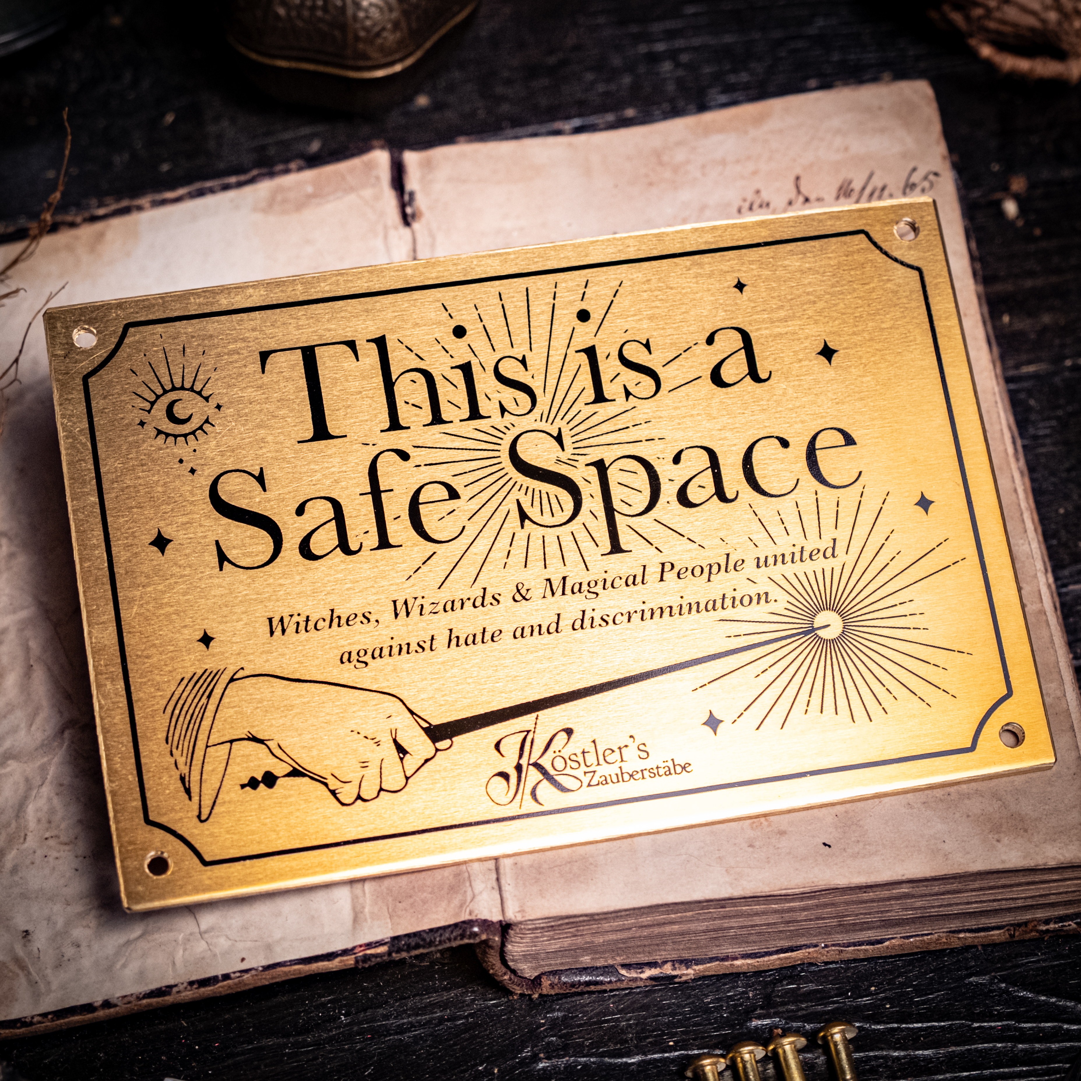 Brass plaque: This is a Safe Space — Witches, Wizards and magical people united against hate and discrimination